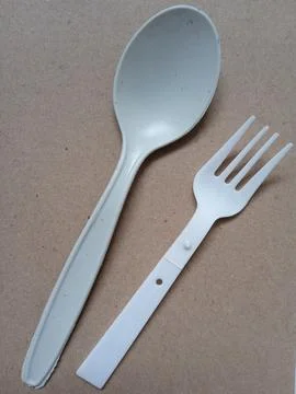 A pair of plastic spoons Stock Photos