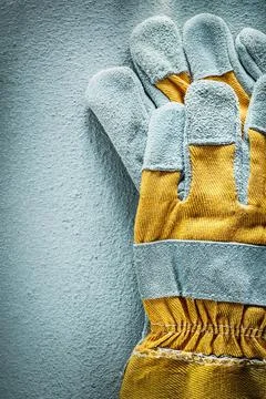 Pair of protective gloves on a concrete background View from above Fotos Stock