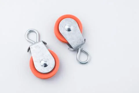 Pair of Pulleys Flat Lay on White Background with Copy Space Stock Photos