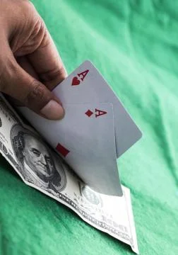 Pair of red aces with $100 bill Stock Photos
