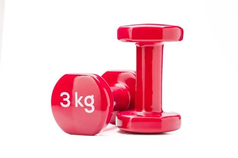 Pair of red dumbbells isolated on white background fitness balance concept Stock Photos