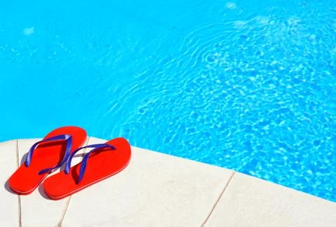 Pair of red flip-flops Stock Photos
