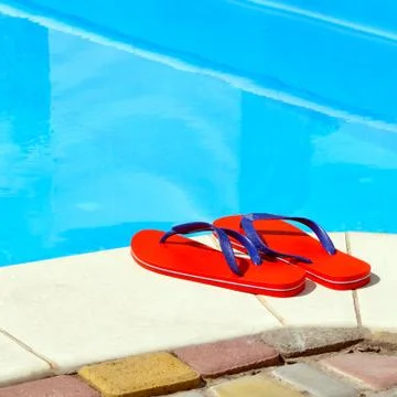 Pair of red flip-flops Stock Photos
