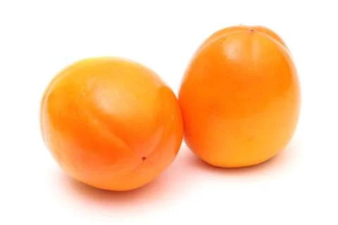 Pair of ripe persimmons Stock Photos