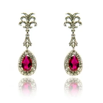 Pair of ruby diamond earrings isolated on white Stock Photos