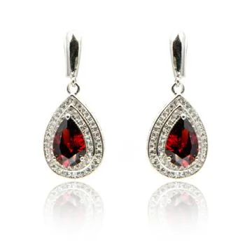 Pair of ruby diamond earrings isolated on white Stock Photos