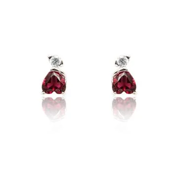 Pair of ruby diamond earrings isolated on white Foto stock