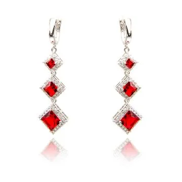 Pair of ruby diamond earrings isolated on white Stock Photos