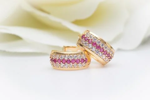Pair of ruby diamond earrings the on white background. 写真素材