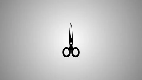 A pair of sharp black scissors with a shiny metallic finish appears in a dy.. 스톡 동영상 346490926