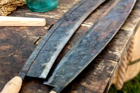 Pair of sharp hand tools for removing bark from a tree trunk, the traditional Stock Photos