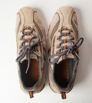 Pair of shoes in reverse. Concept of OCD Stock Photos