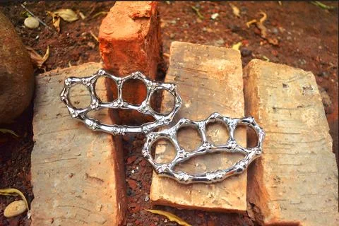 A pair of silver brass knuckles Stock Photos