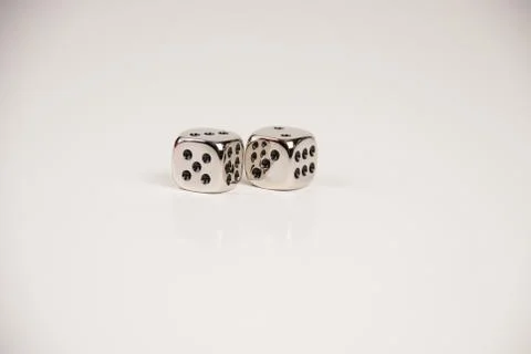 A pair of silver dice Stock Photos