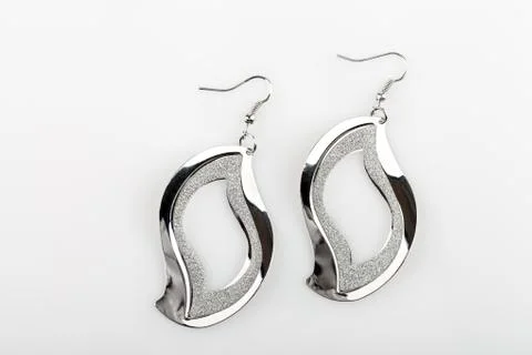 Pair of silver earrings Stock Photos