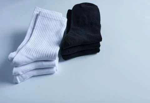 Pair of socks on a white background. Black and white socks. Stock Photos