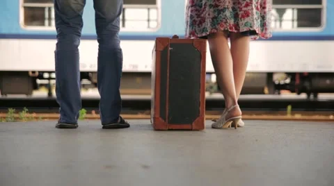Pair at the station with a suitcase Stock Footage 43399221