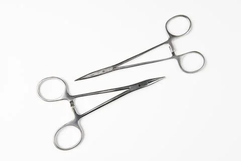 Pair of steel surgical scissors on white background Stock Photos