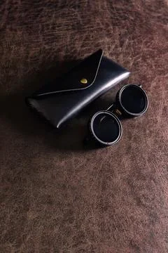 A pair of sunglasses on a table Stock Photos