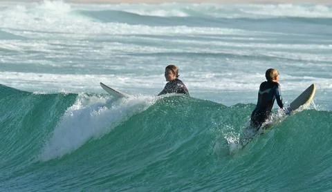 A pair of surfers conquer the Atlantic waves near Ferrol, Spain (7) 25/08/2025 Stock Photos