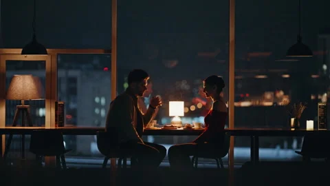 Pair talking night restaurant sitting by panoramic window with city view. Stock Footage 340110829