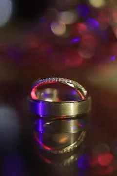 A pair of titanium wedding ring on a blurry background Stock Photos