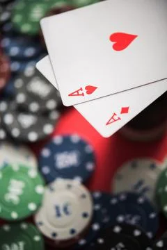 A pair of two aces with poker chips Stock Photos