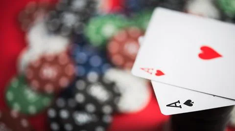 A pair of two aces with poker chips Stock Photos