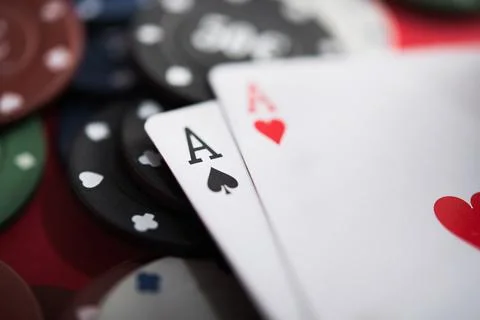 A pair of two aces with poker chips Stock Photos