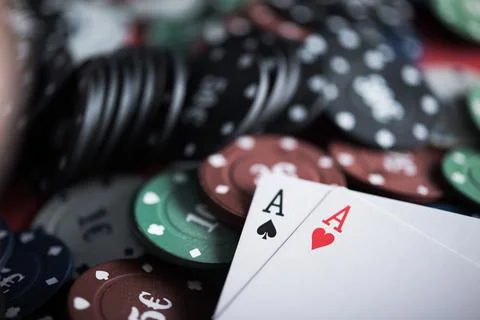 A pair of two aces with poker chips Stock Photos