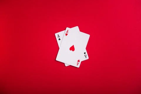 A pair of two aces on a red background Stock Photos