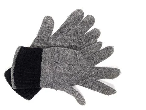 Pair of two warm woolen knitted gloves isolated on white background. Stock Photos
