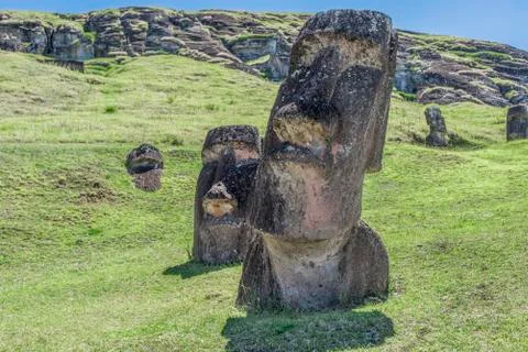 Pair of underground moai on the extinct volcano Rano Raraku Stock Photos