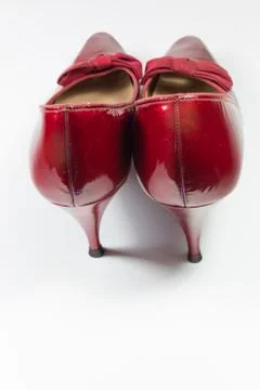 Pair of vintage women's ruby red shoes viewed from the rear, isolated Stock Photos