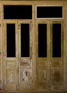 Pair of weathered french wooden doors with isolated windows Stock Photos