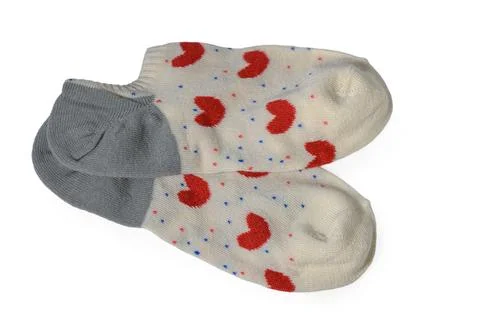 Pair of white ankle socks with red hearts and grey heels isolated on white Stock Photos
