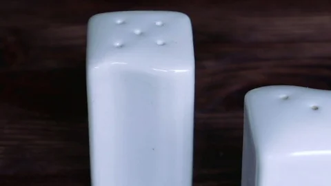 Pair of white salt and pepper pots Stock Footage 72115716