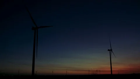 Pair of Wind Turbines at Sunset Dusk Stock Footage 86126858