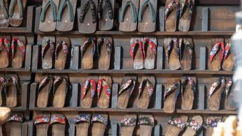 Pair of wooden clogs on the wall Stock Photos