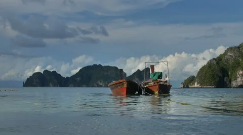 Pair wooden fisher boats moored near Phi Phi island shore Stock Footage 59774884