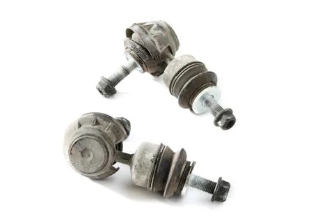 Pair worthless worn stabilizer links isolated on white background Stock Photos