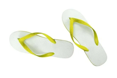Pair of yellow flip-flops isolated on a white background Stock Photos