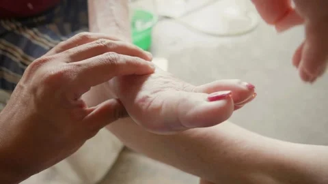 A pair of younger hands gently massages Stock Footage 333113168