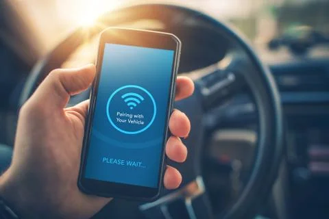 Pairing smartphone with car Fotos de archivo