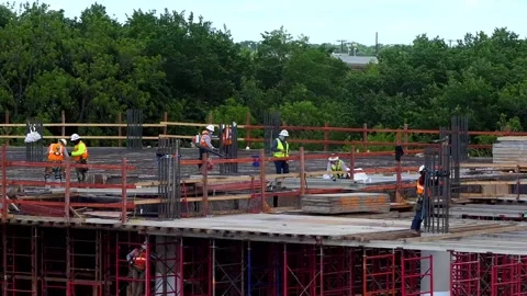 Pairs of workers in different phases of constructing flooring of a building Vídeos de archivo 154217813