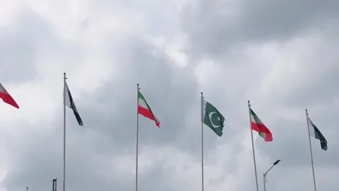 Pakistan and Iran two flags on flagpoles and blue cloudy sky,  動画素材 344649080