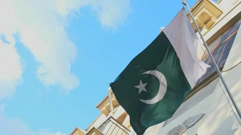 Pakistani flag swaying and fluttering in wind against blue sky with clouds Stock-Footage 330285918