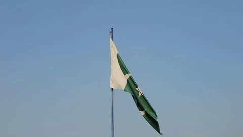 Pakistani flag waves proudly againts blue sky. Pakistan waving flag. Stock Footage 329052972