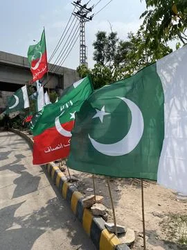 Pakistani Flags and PTI Flags Lined Up for a Celebration Stock Photos