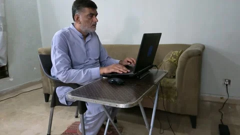 Pakistani man reads message and reacts with disappointment Stock Footage 313741476